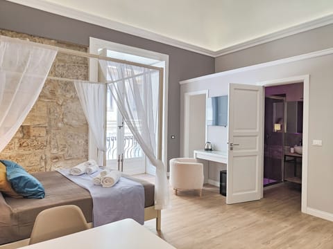 Family Room, Balcony | Individually decorated, individually furnished, desk, laptop workspace