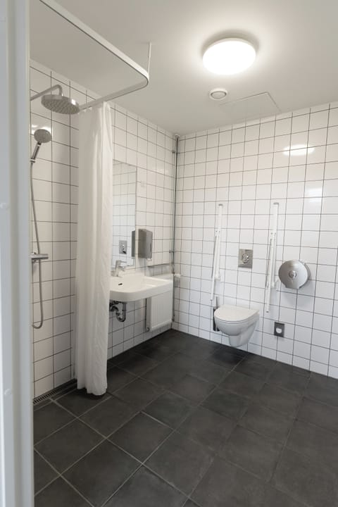 Studio Suite | Bathroom | Shower, toilet paper