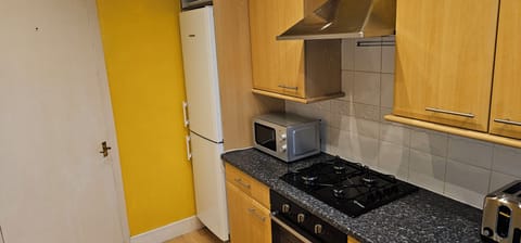 Standard Apartment, Partial Sea View | Private kitchen | Electric kettle, toaster