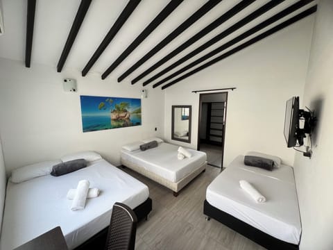 Basic Quadruple Room | Soundproofing, free WiFi, bed sheets