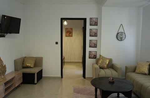 Family Apartment, City View | Living area | Flat-screen TV