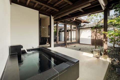Signature Suite, Garden View | Bathroom | Shower, hair dryer, slippers, bidet