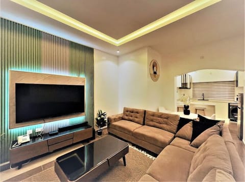 Deluxe Apartment, Balcony, City View | Living area | Flat-screen TV