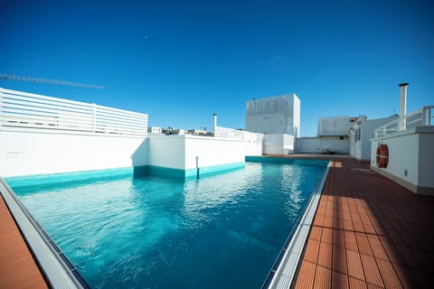 Seasonal outdoor pool, pool umbrellas, sun loungers