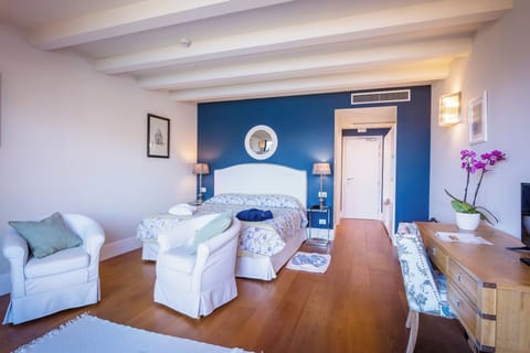 Junior Suite, Lake View | Down comforters, minibar, in-room safe, desk