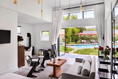 Luxury Suite, Patio, Pool View | In-room safe, soundproofing, free WiFi