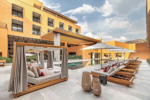 Outdoor pool, open 8:00 AM to 8:00 PM, pool umbrellas, sun loungers