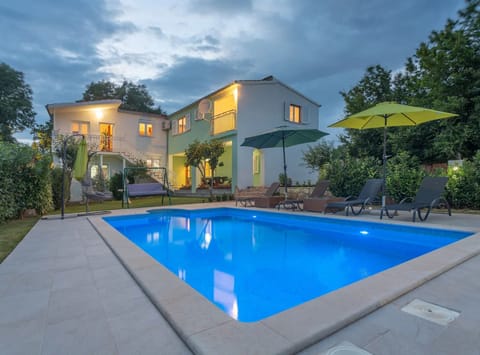 House (Four Bedroom Holiday Home with Pool a) | Outdoor pool | Seasonal outdoor pool, pool umbrellas, sun loungers
