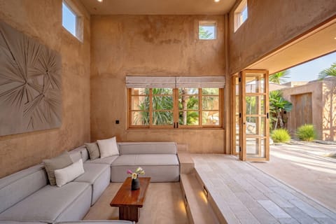 Deluxe Villa, Pool View | Living room | Flat-screen TV