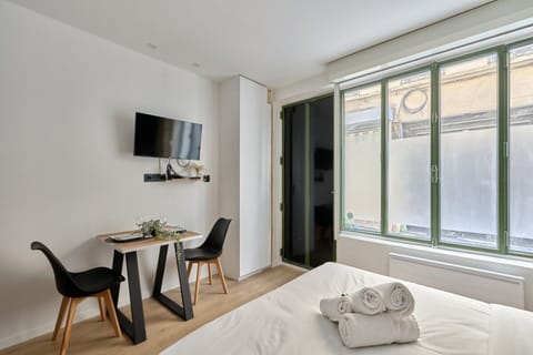 Apartment | Laptop workspace, iron/ironing board, bed sheets