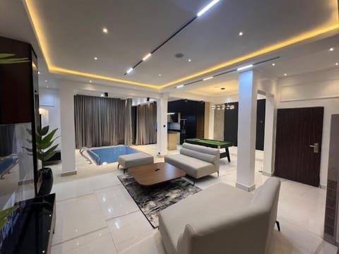 Economy Apartment, Balcony, City View | Living area | Flat-screen TV