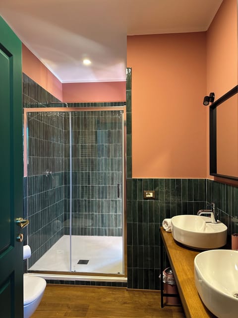 Deluxe Double Room, Golf View | Bathroom | Shower, hair dryer, slippers, towels