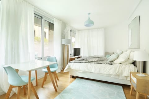 Apartment | Laptop workspace, iron/ironing board, bed sheets