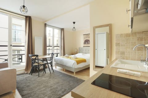 Apartment | Laptop workspace, iron/ironing board, bed sheets