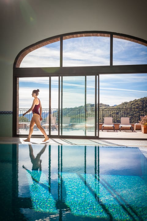Indoor pool, a waterfall pool, sun loungers