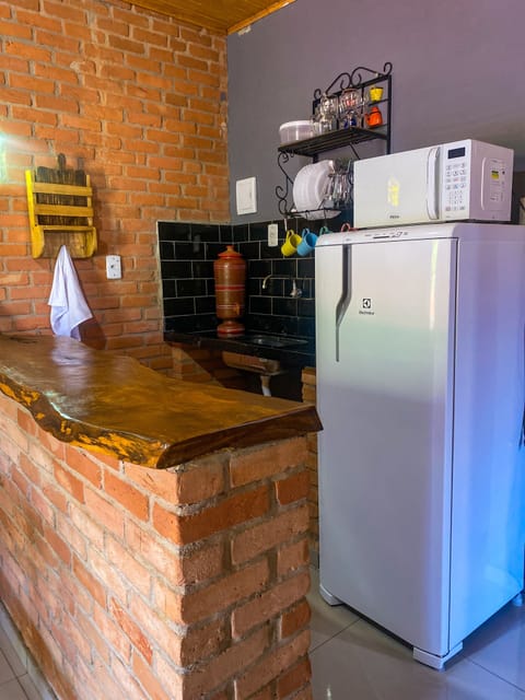 Fridge, microwave, cleaning supplies