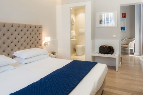 Deluxe Double Room, Balcony, Pool View | Minibar, in-room safe, desk, iron/ironing board