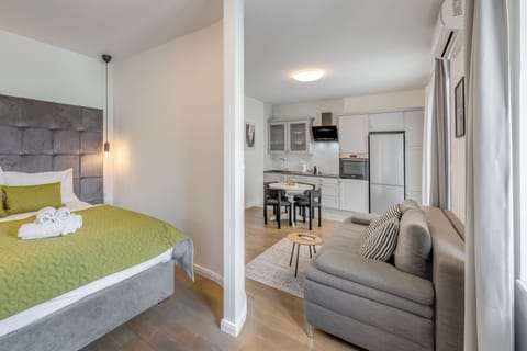 Deluxe Apartment, Balcony | In-room safe, desk, blackout drapes, soundproofing