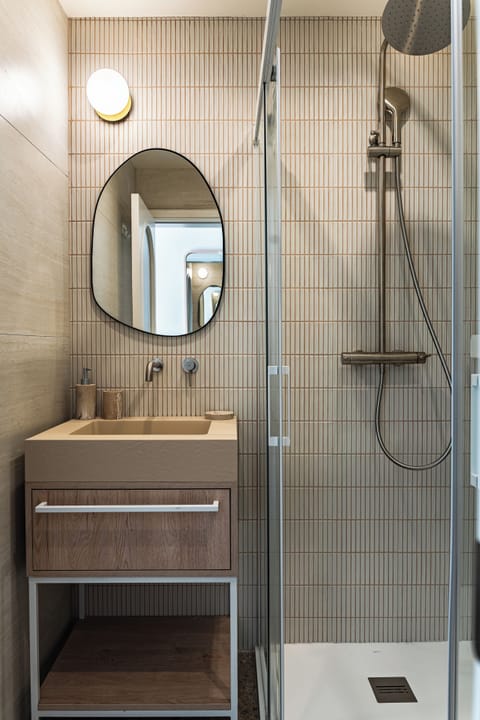 Shower, rainfall showerhead, hair dryer, towels