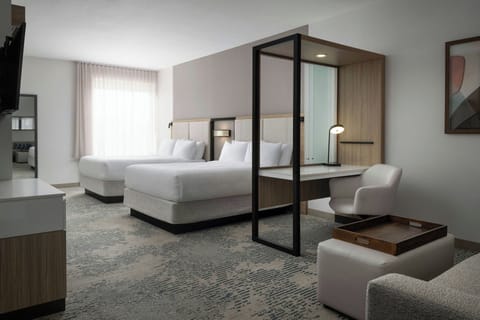 Desk, laptop workspace, iron/ironing board, free cribs/infant beds