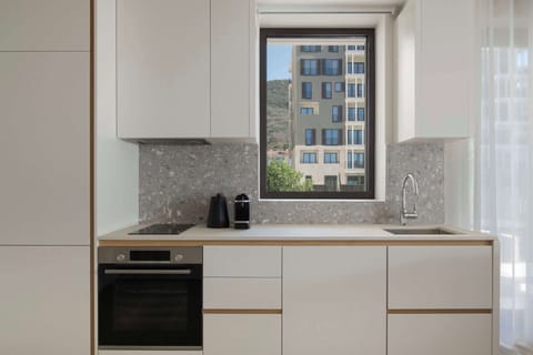 Family Studio (SIRO Apartment) | Private kitchen | Espresso maker, electric kettle, highchair