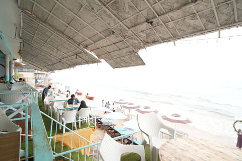 On the beach, white sand, sun loungers, beach umbrellas