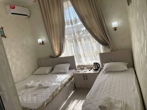 Comfort Double or Twin Room, City View | Desk, blackout drapes, iron/ironing board (on request), WiFi (free)