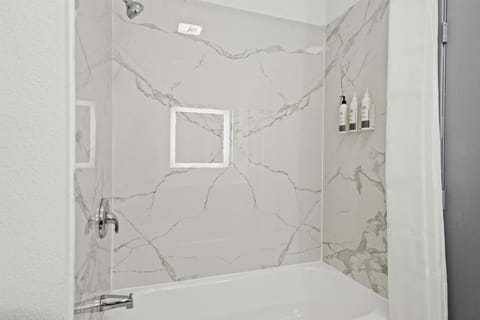 Separate tub and shower, hair dryer, towels, soap