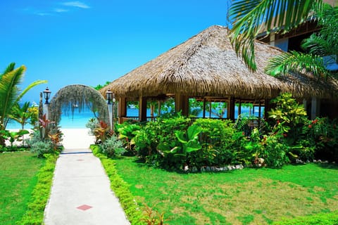 On the beach, white sand, sun loungers, beach umbrellas