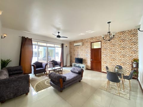 Basic Apartment, Garden View | Living area | Flat-screen TV