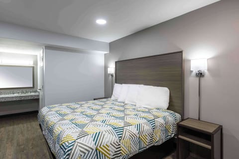 Desk, laptop workspace, blackout drapes, iron/ironing board