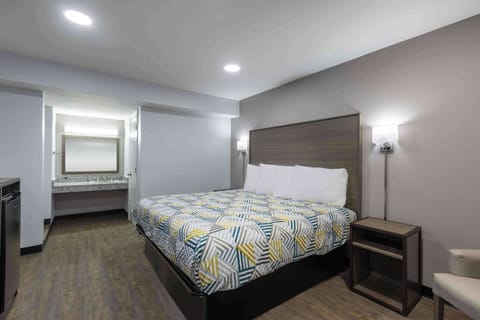 Desk, laptop workspace, blackout drapes, iron/ironing board