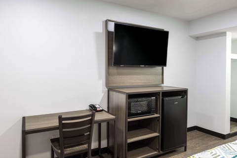 Desk, laptop workspace, blackout drapes, iron/ironing board