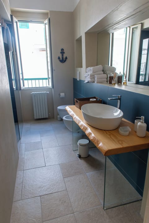 Deluxe Triple Room, Balcony, City View | Bathroom | Shower, hair dryer, bathrobes, towels