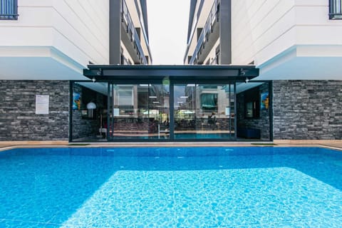 Outdoor pool, open 8:00 AM to 10:00 PM, pool umbrellas, sun loungers