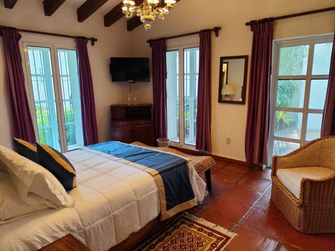 Deluxe Suite, 1 Queen Bed | Blackout drapes, iron/ironing board, free WiFi, bed sheets