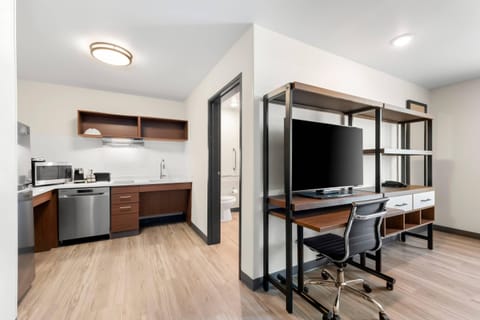 Desk, laptop workspace, blackout drapes, iron/ironing board