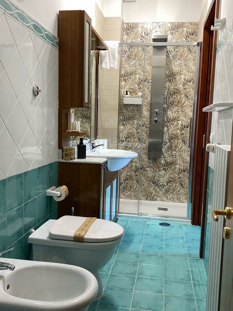 Junior Suite, City View | Bathroom | Hair dryer, slippers, bidet, soap