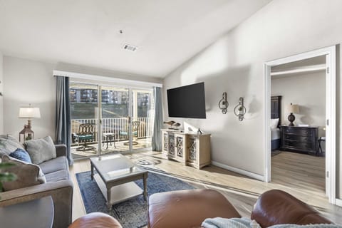 Condo, 1 King Bed with Sofa bed, Balcony, Golf View (Calm Waters Condo) | Living area | 42-inch flat-screen TV with digital channels