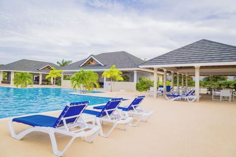 Outdoor pool, open 7:00 AM to 8:00 PM, pool umbrellas, sun loungers