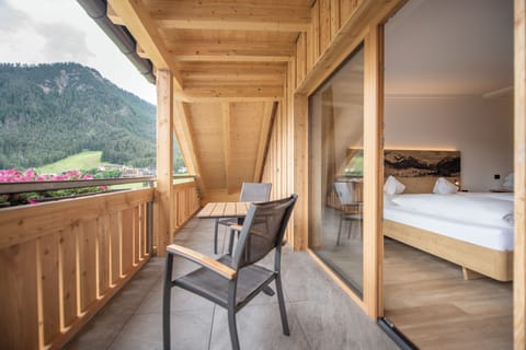 Superior Triple Room | Minibar, in-room safe, desk, laptop workspace