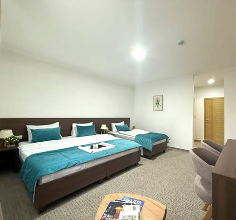 Triple Room, Pool View | In-room safe, desk, blackout drapes, soundproofing