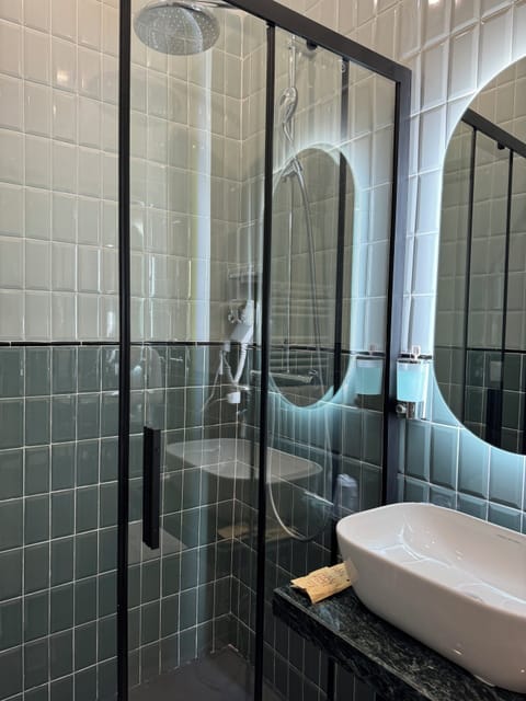 Shower, free toiletries, hair dryer, slippers