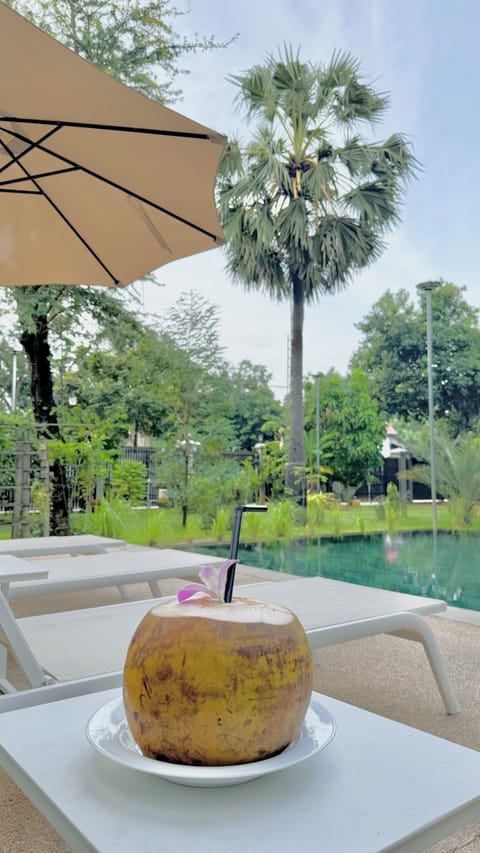 Outdoor pool, open 7:00 AM to 9:00 AM, free cabanas, pool umbrellas