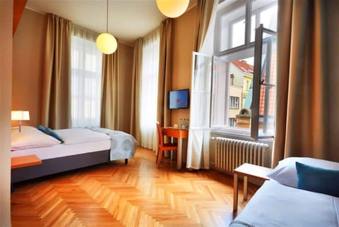 Triple Room | Minibar, in-room safe, desk, laptop workspace