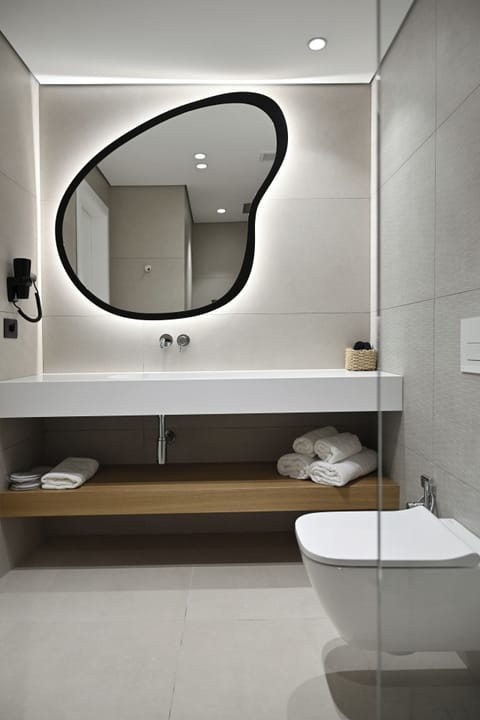 Shower, hair dryer, slippers, towels