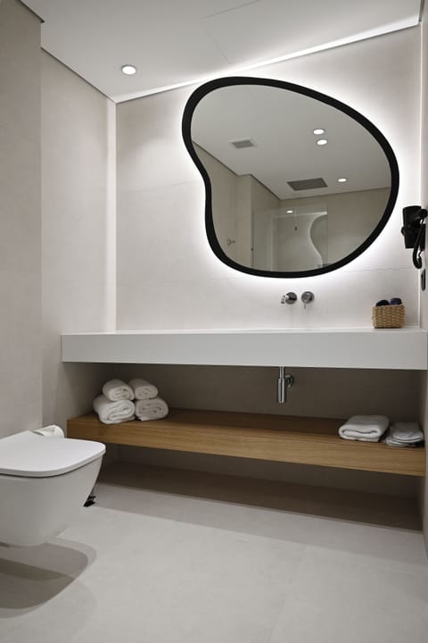 Shower, hair dryer, slippers, towels