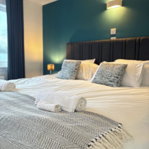 Premium bedding, Select Comfort beds, desk, laptop workspace