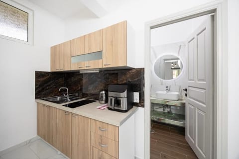 Deluxe Apartment, 2 Bedrooms, Balcony, Pool View | Private kitchen | Mini-fridge, stovetop, cookware/dishes/utensils