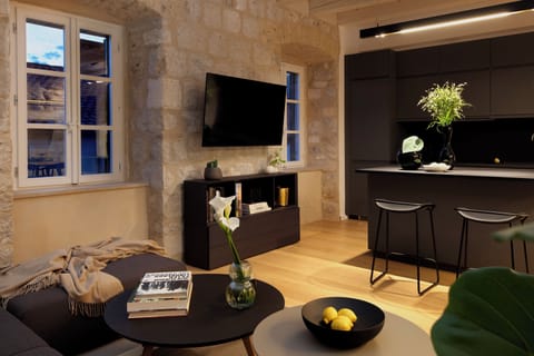 Luxury Apartment, City View | Living area | 30-cm Smart TV with satellite channels